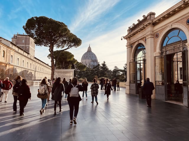 A group of students walking outside the Vatican.